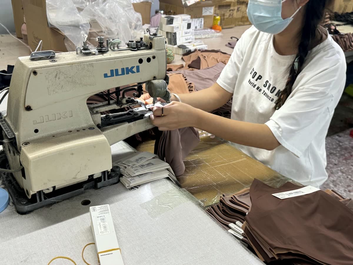 Private label tag sewing and packaging preparation